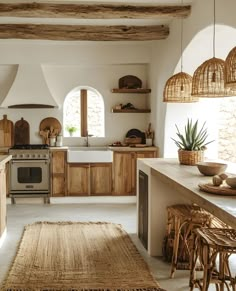 a kitchen with an oven, sink, and counter top in the middle of it