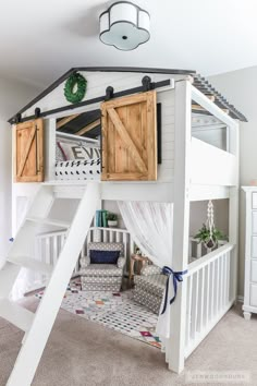 a loft bed with wooden shutters and stairs