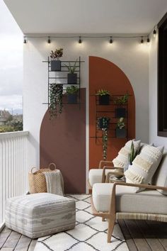 an outdoor living area with furniture and potted plants