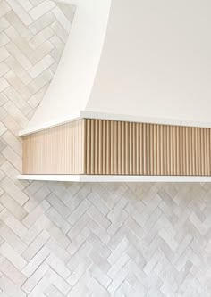 a stove top oven sitting inside of a kitchen next to a white tiled countertop