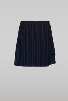 Slightly a-shaped navy mini skirt with overlapping front raw edges and pockets. pair with pinstripe suit jacket.    this skirt is slightly small in size. the model is wearing s and is 175 cm.    69% polyester 29% viscose 2% elastane 45% viscose 55% polyester Pin Stripe Skirt, Pinstripe Skirt, Navy Mini Skirt, Metallic Loafers, Executive Assistant, Lace Button, Pinstripe Suit, Engineered Garments, Knit Tanks