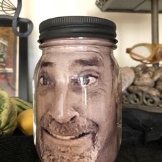 a jar with a face painted on it