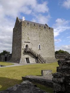 an old castle with stairs leading up to it