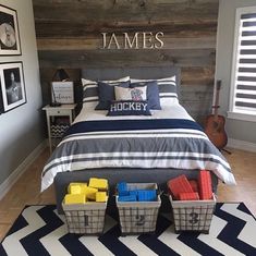 a bed room with a neatly made bed and two baskets on the floor next to it