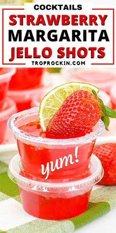 strawberry margarita jello shots in plastic cups with limes and strawberries on the side