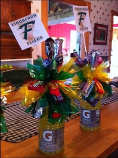 two bottles filled with candy sitting on top of a table