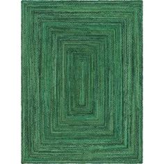 a green rug with an intricate design on the center and bottom corner, in square shape