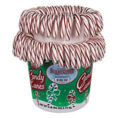 candy canes are stacked in a cup