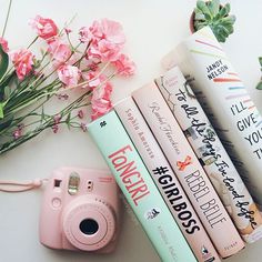 pink camera, books and flowers on white surface with text reading i'll give you enough