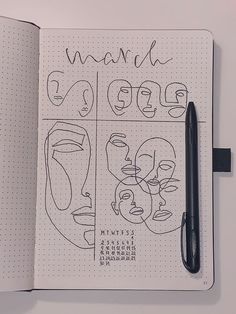 an open notebook with some drawings on it