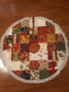 a round table with a clock made out of patchwork