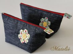 two zippered pouches with flowers on them