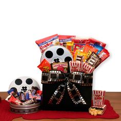 a movie themed gift basket with popcorn, candy and snacks