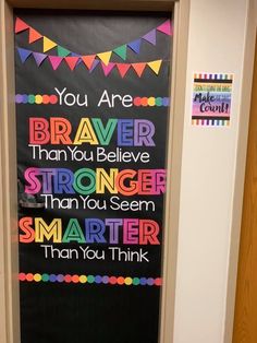 a bulletin board that says you are braver than you believe stronger than you seem smarter than you think