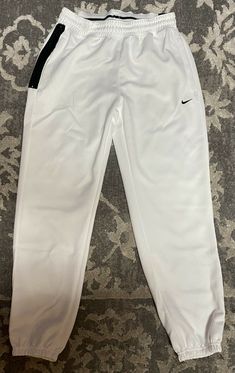 Brand: Nike Size: Mens Small Color: White/Black Condition: Brand new with tags Description: Nike Dri-Fit Spotlight Basketball Pants Terms & Conditions: All sales are final. Shipping: $5 with free tracking number within US. International Standard Shipping $25. White Straight Leg Joggers For Spring, White Straight Leg Spring Joggers, White Straight-leg Joggers For Spring, Nike White Joggers For Spring, White Straight Leg Athleisure Pants, Sporty White Straight Leg Pants, White Sporty Straight Leg Pants, Nike White Sweatpants For Spring, Sporty White Straight Leg Joggers