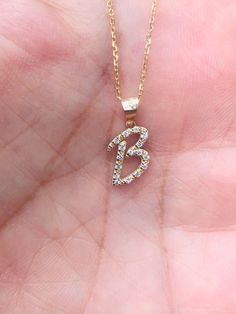 "Necklace Details: Gold Purity: 14K Available Gold Color: Rose Gold, Yellow Gold, White Gold Pendant Size 10x7mm  Number of Diamonds : Letter  B 16 Stones  Total CTW: 0.09 Diamond Color-Clarity: G Color SI Clarity Chain Style :Cable If you have any additional questions about this product, just hit the \"Ask a Question\" button (just to the right of the price) and we will get back to you within a few hours. Be sure to hit \"favorite\" on the right so it remains on your favorites list and/ or add Anniversary Rose Gold Initial Necklace In 14k Gold, Rose Gold 14k Gold Initial Necklace For Anniversary, Anniversary 14k Rose Gold Initial Necklace, B Necklace, Script Initial, Diamond Initial Necklace, Gold Letter Necklace, White Gold Pendant, Gold Letter