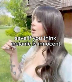 a woman blowing a dandelion with the words save if you think melanie is innocent