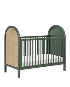 a green crib with a wicker bed frame and mattress in the bottom half