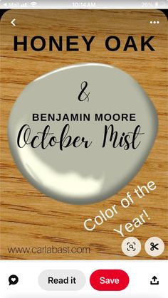 a wooden table with a button that says, honey oak and benjam moore october mist