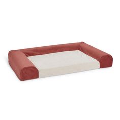 the dog bed is made from red and white fabric