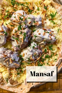 a plate filled with food and the words mansaf written in white over top of it