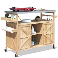 a kitchen island with sliding doors on wheels