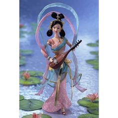 a figurine is holding a guitar in front of water lilies and lily pads