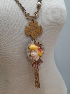 This unique and one of a kind assemblage necklace features various vintage Girl Scout and Brownie pins, along with two different vintage chains and pearls.   The Brownie girl is a 1950s celluloid pin, attached to an antique pocket watch dial.   Necklace length is about 28-30 inches long--slides easily over the head. Vintage Handmade Metal Chain Necklace, Handmade Vintage Metal Chain Necklace, Retro Brass Necklaces With Vintage Charm, Vintage Charm Brass Necklace In Retro Style, Retro Brass Necklace With Vintage Charm, Handmade Vintage Style Chain Necklace As Gift, Vintage Collectible Charm Necklaces, Vintage Brass Necklaces With Charms, Vintage Handmade Brass Chain Necklace