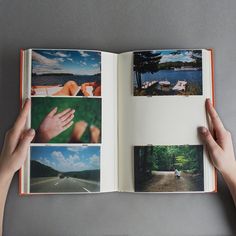 someone holding an open book with pictures on the pages and in front of them is a person's hand