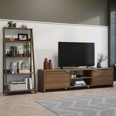 a living room with a large television and shelving unit