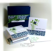 three cards with blue and green flowers on them