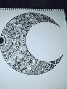 a drawing of a crescent moon with intricate designs