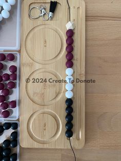 an assortment of beads are arranged on a cutting board