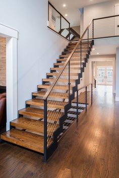 there is a wooden stair case in the house