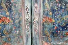 an ornate painted wooden door with flowers and birds on it