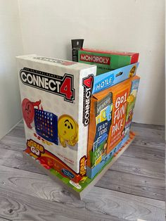 a stack of games sitting on top of a wooden floor