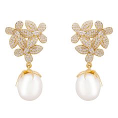 Introducing the gorgeous Flowers Baroque Pearl Earrings, the must-have statement jewellery piece of the season. These elegant earrings feature a romantic floral-inspired design. Three delicate blossoms set as if in a bouquet boast an abundance of dazzling cubic zirconia on each petal with a beautiful baroque pearl dangling provocatively beneath, giving it an extra special touch of sophistication. Baroque pearls are naturally formed with organic & irregular shaping.Pearls are an elegant, classic White Gold Flowers, Pearl Earrings Gold, Stylish Bride, Pearl Birthstone, Gorgeous Flowers, Baroque Pearl Earrings, Statement Jewellery, Gold Pearl Earrings, Pearl Gemstone