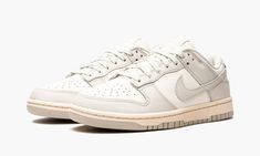 The Women’s Nike Dunk Low “Light Bone” is an inherently vintage, two-tone, white-and-grey colorway of the women’s sizing of the retro basketball shoe by Nike.  Inadvertently, the “Light Bone” mimics the look of many Dunk colorways found in Off-White and Nike’s “Lot 50” collection from August 2021.  Like “Lot 50,” the “Light Bone” features a simple, easy-to-wear color palette and subtle vintage-inspired details.  Here, Sail leather appears on the perforated toe, mid-panel, collar, and heel.  The Nike Dunk Low Light Bone, Dunk Low Light Bone, Womens Dunk Low, Nike X Travis Scott, Retro Basketball Shoes, Low Air Jordan 1, All Nike Shoes, Dunks Nike, Tactical Clothing