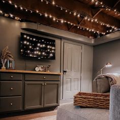 a living room filled with furniture and a flat screen tv mounted to the wall over a fireplace