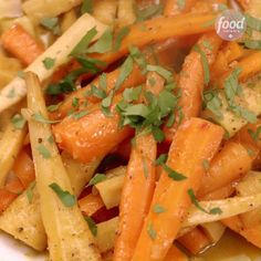 a white plate topped with carrots and parsley