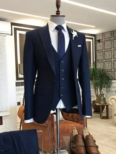 This is a Classic 3 Piece Suit crafted from high quality fabric and imported materials. Our products are handcrafted by experienced tailors who make sure the that the stitching is precise, lining is proper and the overall product is sturdy enough to not go out of shape for more than a few years. Also all our products have extra margins in their length, sleeves, sides so it's easily alterable if your size changes after some time. To see more available colours and designs in this collection,  *We also offer customization so we can provide you an even better fit if you massage us your measurements (in inches) of Chest, Stomach, Waist, Hip, Shoulder and Actual Height after ordering. *Want this product but in slightly different design or colour? Tell us and we'll work it out. *Feel Free to mess Dark Blue Blazer Outfit Men, Navy Suit Outfit Men, Mens Prom Suits, Suite For Men, Waistcoat Men Wedding, Blue Blazer Outfit Men, Navy Blue Suit Men, Navy Blue Suit Wedding, Wedding Suits Men Blue