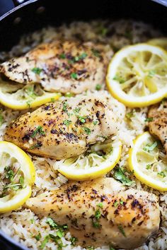 chicken with lemons and rice in a skillet