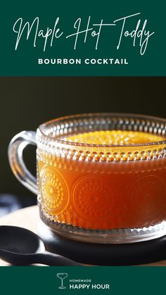 maple hot toddy bourbon cocktail in a glass mug with spoons on the side