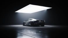 a sports car is shown in the dark