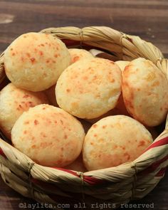 some bread rolls in a basket on a table