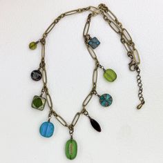 This colorful necklace is casual and fun. It is composed of various size, shape, and color Czech glass beads that are wire wrapped and attached to an antique brass chain. All components are antique brass including the adjustable lobster clasp. The necklace ranges 20" - 22" in length, with the center bead dangling 1 1/2". Available in other colorways.  Note: bead colors and/or bead combinations may vary due to availability. Colorful Czech Glass Bead Necklace, Adjustable Multicolor Czech Glass Necklace, Multicolor Czech Glass Long Necklace, Colorful Multi-strand Czech Glass Beaded Necklaces, Bead Combinations, Beaded Dangle Necklace, Multi-strand Czech Glass Colorful Beads Necklace, Dangle Necklace, Colorful Necklace