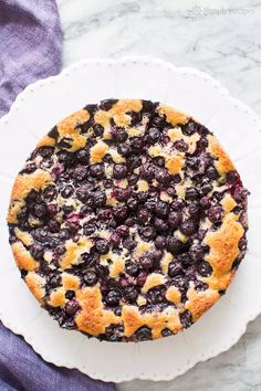 a blueberry brame cake on a white plate