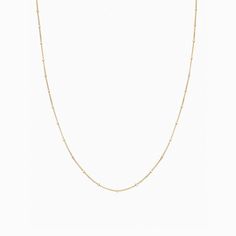 A beaded necklace like our Savannah Necklace deserves a place of honor in your closet. This dainty, single-layered necklace comes in gold plating over sterling silver and features a beaded design. It's slender but unique and eye-catching nonetheless. The design features a string of beads ending in a bigger adornment along the length of the necklace. - Gold plating over Sterling Silver - Available in Yellow Gold and White Gold Jewelry Sterling Silver, Cross Pendant Necklace, Layered Necklace, Chain Link Necklace, Silver Diamonds, Necklace Gold, Gold Plating, Layered Necklaces, Cross Pendant