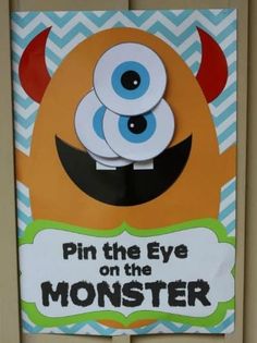 a sign that says pin the eye on the monster