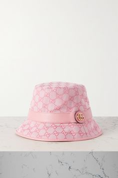 Bucket hats are part of the '90s revival that shows no sign of slowing. This one from Gucci comes in lightweight but hard-wearing cotton-blend canvas that's jacquard-woven with the house's unmistakable 'GG' logo. The tonal leather trim is topped with a gold-tone moniker.